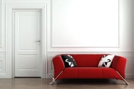 red couch in white room