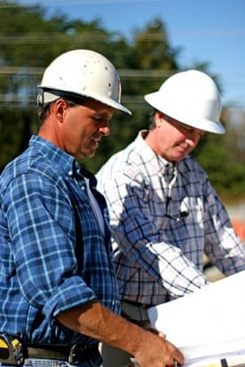 contractors reviewing blueprints