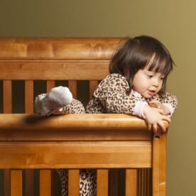 Baby Climbing Out of a Crib