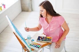 watercolor artist at work in her studio