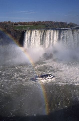 Niagara Falls - New York and Ontario - with a rainbow and the Maid of the Mist
